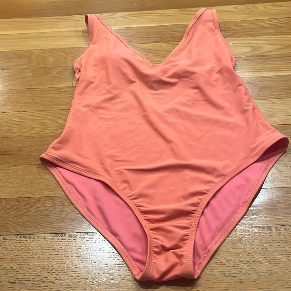 Kona sol women’s peach color vneck one piece swimsuit size xlarge.